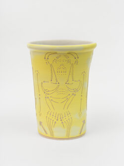 Lymphatic II
2022 A large yellow wheel-thrown ceramic cylinder that is wider at the top with a white interior. The surface is carved with lines that indicate directional movement of lymphatic fluid in the human body.