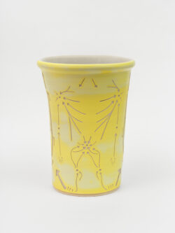 Lymphatic II
2022 A large yellow wheel-thrown ceramic cylinder that is wider at the top with a white interior. The surface is carved with lines that indicate directional movement of lymphatic fluid in the human body.