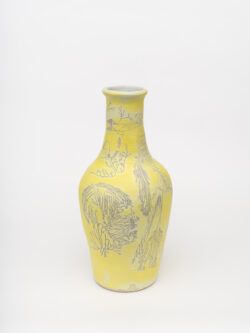 Neural I
2022 A tall, large yellow wheel-thrown ceramic vessel that has a wider round shoulder and comes to a smaller opening at the top, much like a bottle, with a white interior. The surface is carved with diagrams of the nervous system.