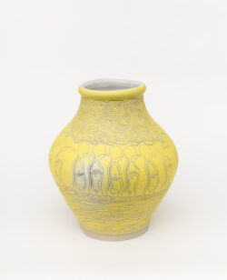 Circulatory III
2022 A large yellow wheel-thrown ceramic vessel that has a wide round shoulder and comes to a smaller opening at the top with a white interior. The surface is carved with diagrams of circular breathing and patterns of cells.