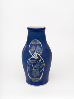 Circulatory I
2022 A large blue wheel-thrown ceramic vessel that has a wide shoulder and comes to a smaller opening at the top with a white interior. The surface is carved with several diagrams representing the circulatory system of the human body.