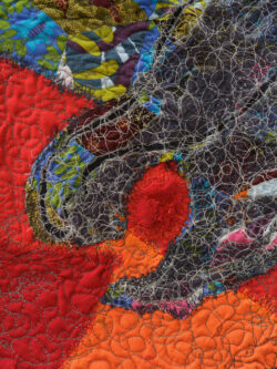 Fire 2022 This is a detail image of the Fire quilt. The details shows the intense circular stitching overtop of the smoke dragon.