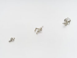 Untitled (Spirit 3)
2023 Three different clusters of mirrored rings ascending and protruding off of the wall. Resembling something found in the ocean or on a molecular scale.
