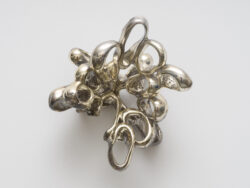 Untitled (Spirit 7)
2023 A cluster of mirrored rings protruding off of the wall. Resembling something found in the ocean or on a molecular scale.