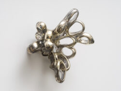 Untitled (Spirit 7)
2023 A cluster of mirrored rings protruding off of the wall. Resembling something found in the ocean or on a molecular scale.