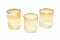 two iridescent gold blown glass cups.