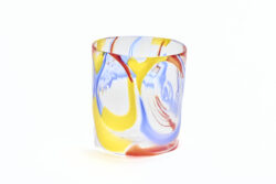 Large glass cylinder with red yellow and blue windows throughout.