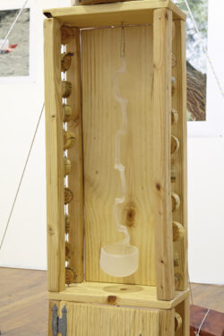 Kombucha House
2015 Detail image of the work Kombucha House. It shows the fragile glass spoon that is hanging in the cabinet of the structure.