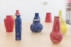 Let Me Touch You 2023 Installation view of exhibition Let Me Touch You. Ceramic vessels on a wooden platform.