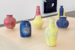 Let Me Touch You 2023 Installation view of exhibition Let Me Touch You. Ceramic vessels on a wooden platform.